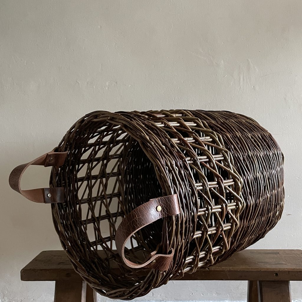 large willow storage basket with Irish diagonal side weave leather handles on side